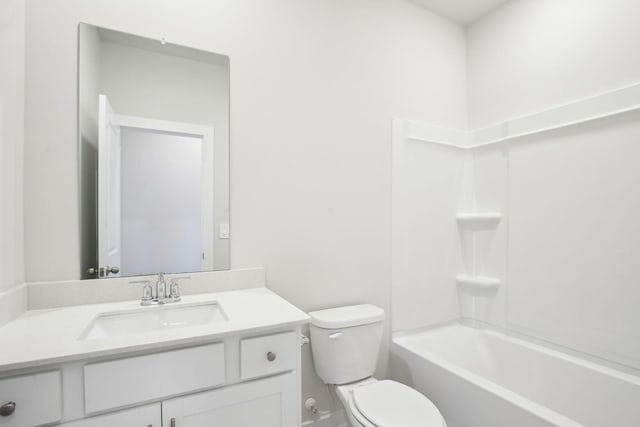 bathroom with  shower combination, vanity, and toilet