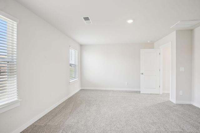 unfurnished room featuring carpet floors, recessed lighting, visible vents, and baseboards