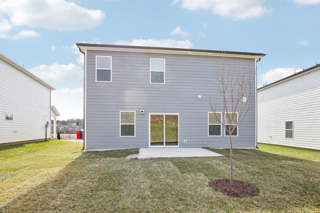 back of house featuring a patio and a lawn