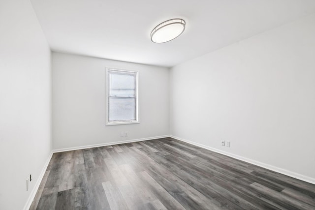 spare room featuring dark hardwood / wood-style floors