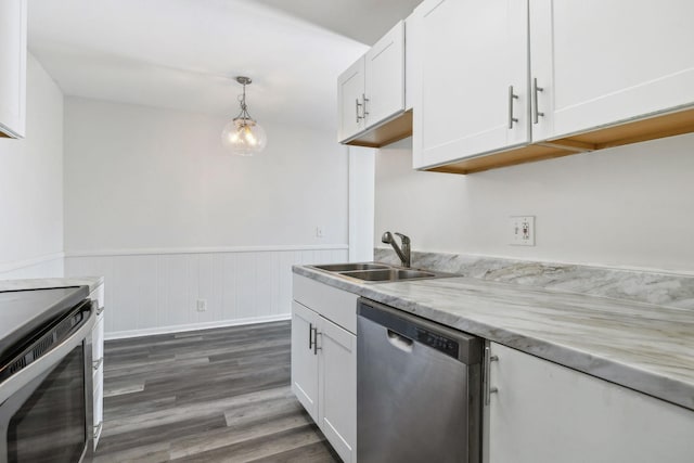 kitchen with stove, sink, dishwasher, white cabinetry, and hanging light fixtures