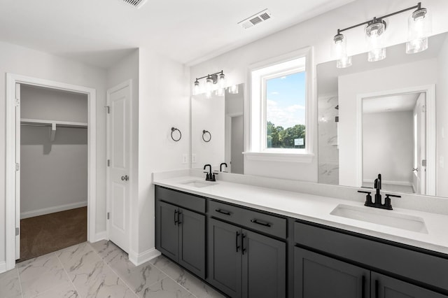 bathroom with a shower and vanity