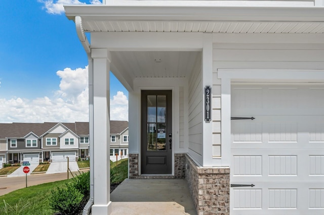 doorway to property featuring a garage