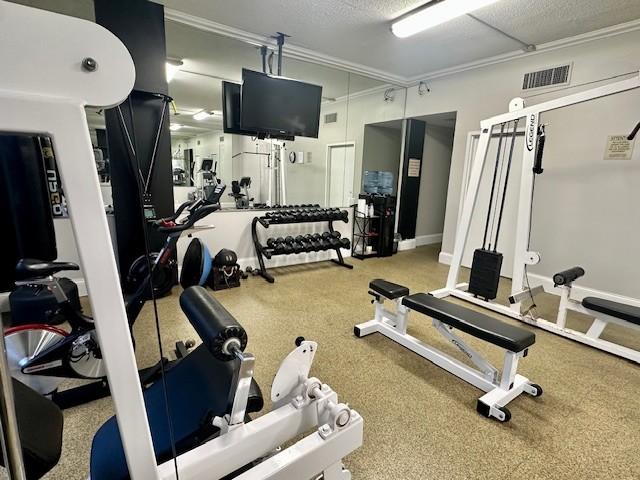 workout area featuring a textured ceiling