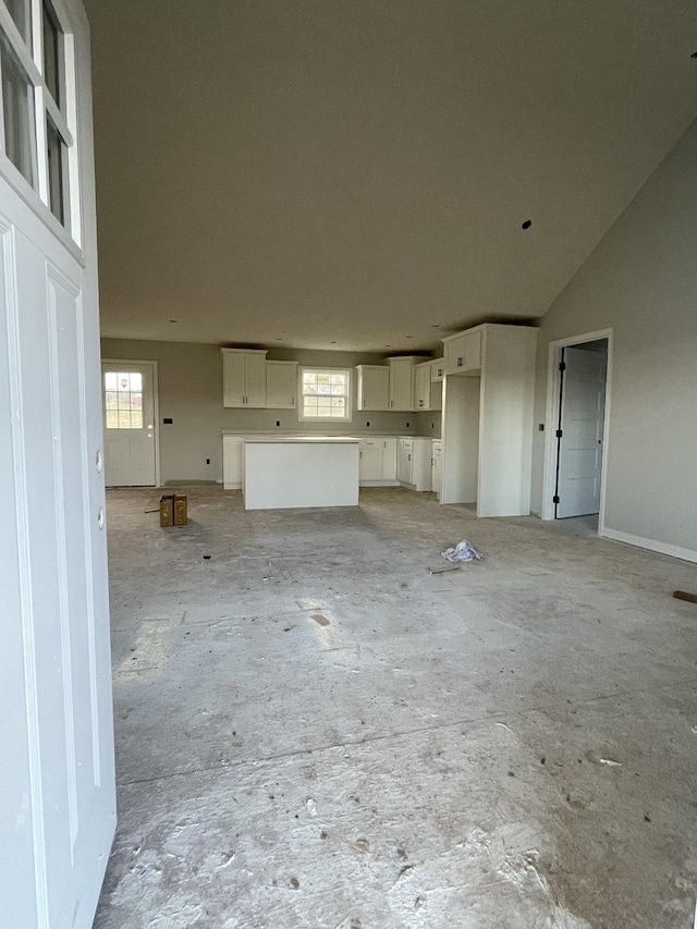 unfurnished living room featuring a wealth of natural light