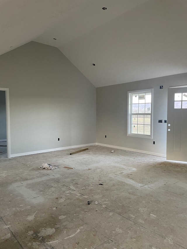 empty room with lofted ceiling