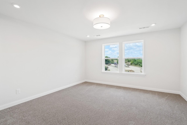 unfurnished room with carpet flooring