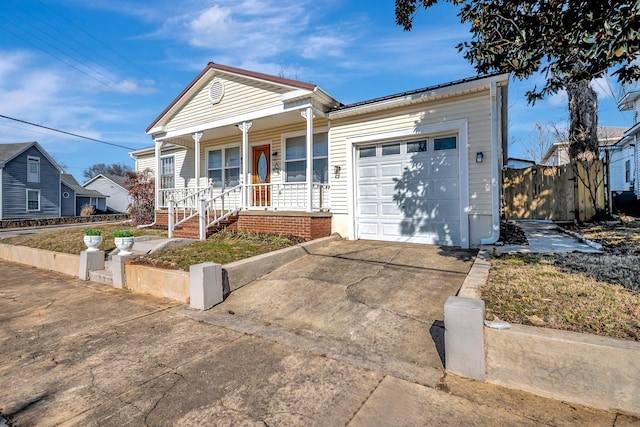 view of front of house with a garage and covered porch