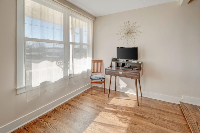 home office with light wood-type flooring