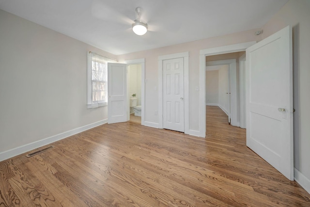 unfurnished bedroom with ceiling fan and light hardwood / wood-style flooring