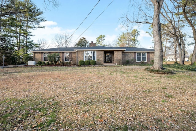 ranch-style home featuring a front yard