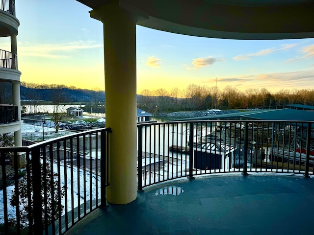 view of balcony at dusk