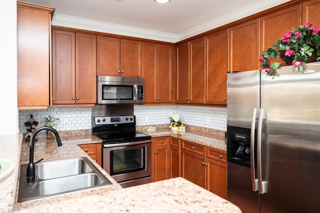 400 Warioto Way Unit 206, Ashland City, TN 37015 - kitchen with a sink, backsplash, appliances with stainless steel finishes, and brown cabinetry