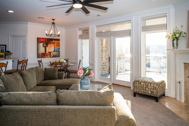 400 Warioto Way Unit 206, Ashland City, TN 37015 - living area with visible vents, ceiling fan with notable chandelier, and plenty of natural light