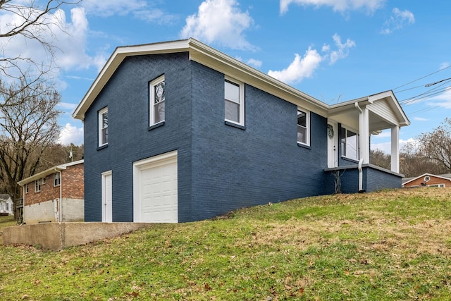 view of property exterior featuring a yard and a garage