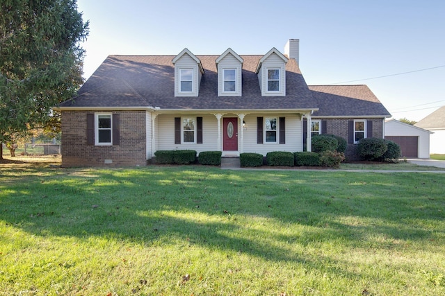 cape cod-style house featuring a porch and a front lawn