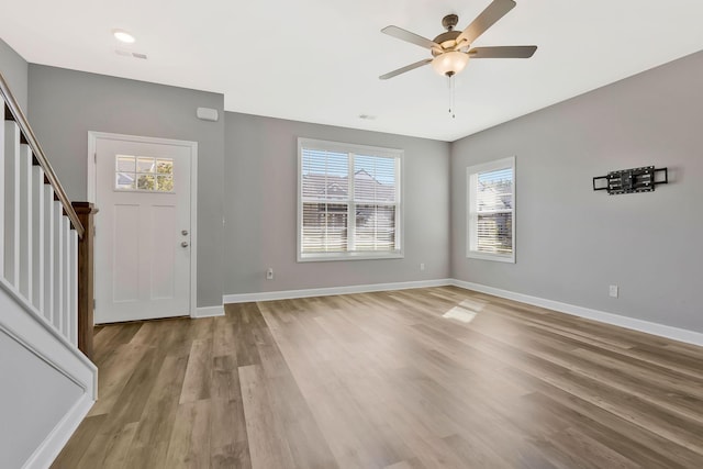 foyer entrance featuring light hardwood / wood-style flooring and ceiling fan