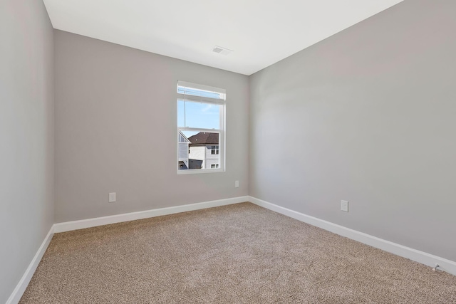 spare room featuring carpet floors