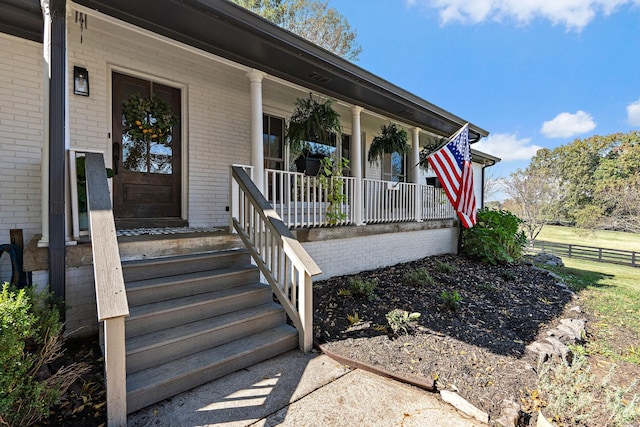 property entrance featuring covered porch