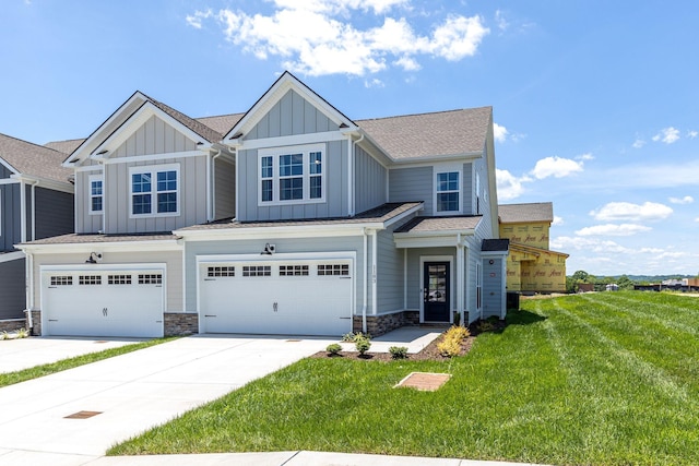 view of front of property with a garage and a front yard