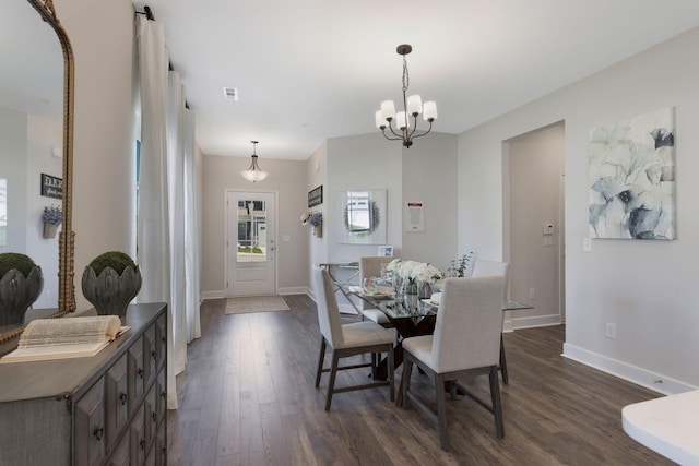 1120 June Wilde Rdg, Spring Hill, TN 37174 - dining space with dark wood-type flooring and an inviting chandelier