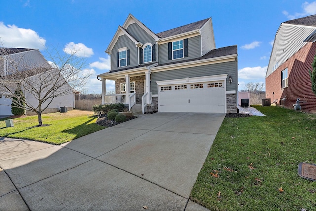 view of front of property with a front lawn, covered porch, central AC unit, and a garage