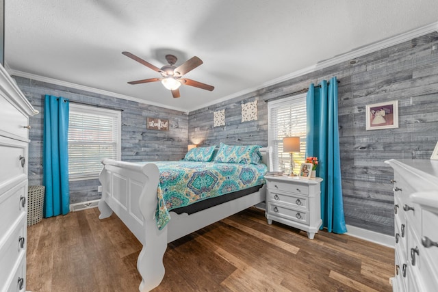 bedroom with ceiling fan, crown molding, and multiple windows