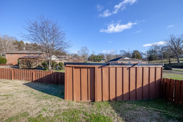 view of outbuilding featuring a lawn