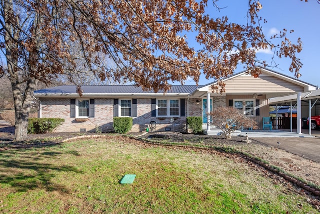 ranch-style house with a front lawn and a carport