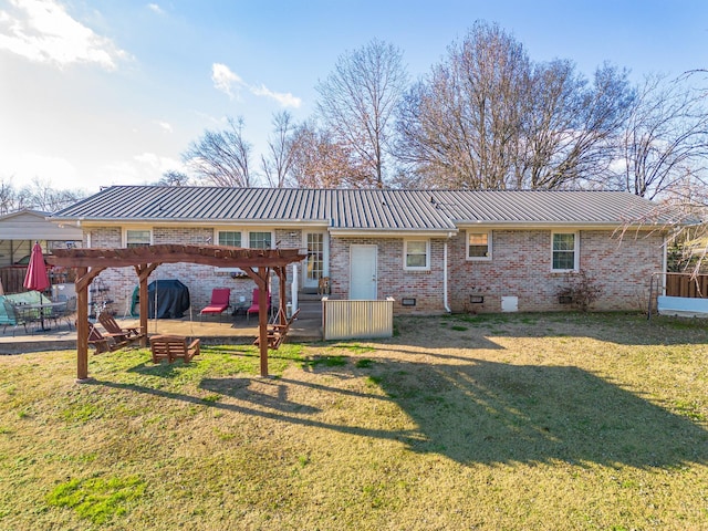 rear view of house with a yard and a pergola