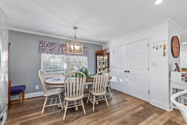 dining area with crown molding, dark hardwood / wood-style floors, and an inviting chandelier