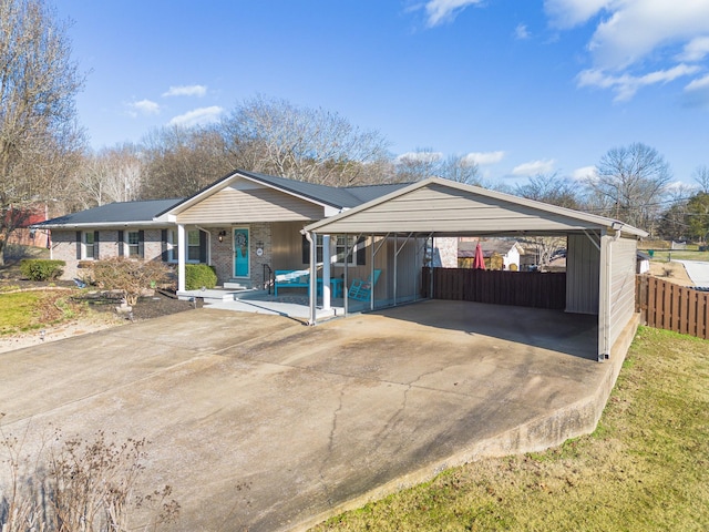 ranch-style home with a carport