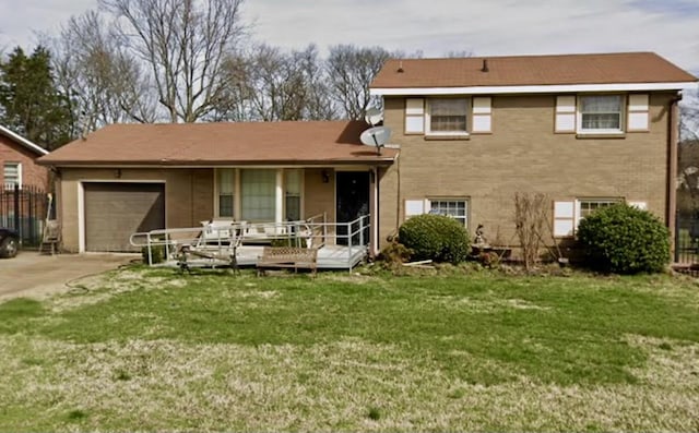 split level home with a front lawn and a garage