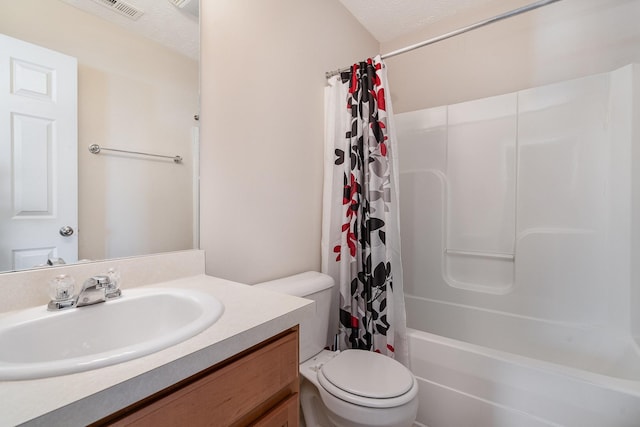 full bathroom with shower / bath combination with curtain, toilet, a textured ceiling, and vanity