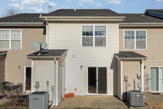 back of property featuring central AC and a patio