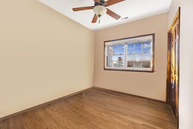 spare room featuring ceiling fan and light hardwood / wood-style flooring