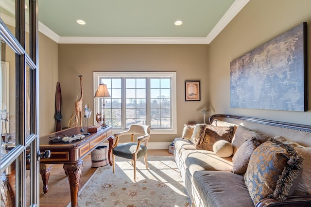 office area featuring ornamental molding and light hardwood / wood-style floors