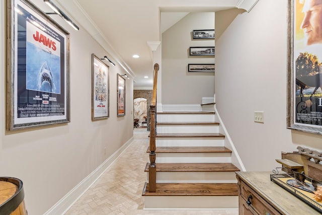 staircase featuring crown molding