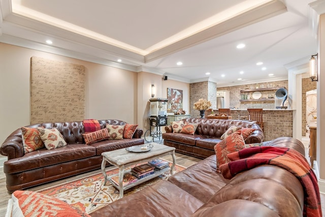 living room featuring ornamental molding and light hardwood / wood-style floors