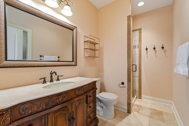 bathroom with vanity, toilet, and a shower with door