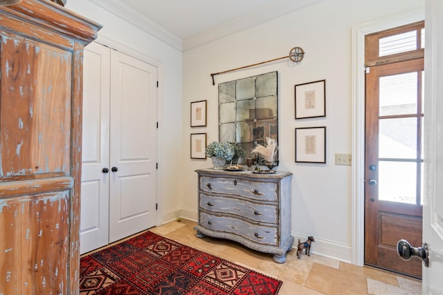 entryway featuring ornamental molding