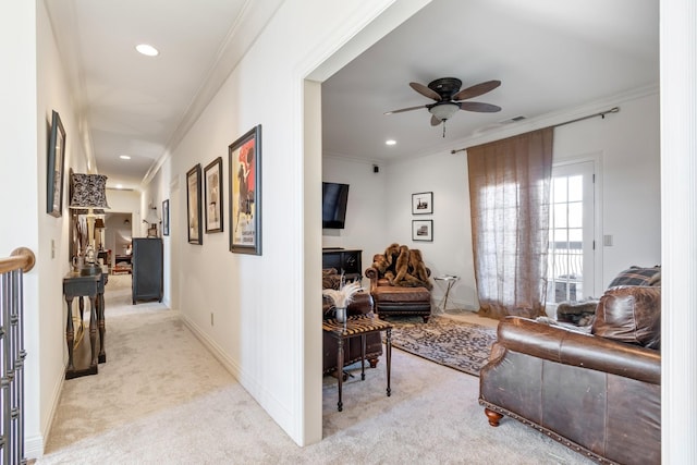 interior space featuring crown molding and light carpet