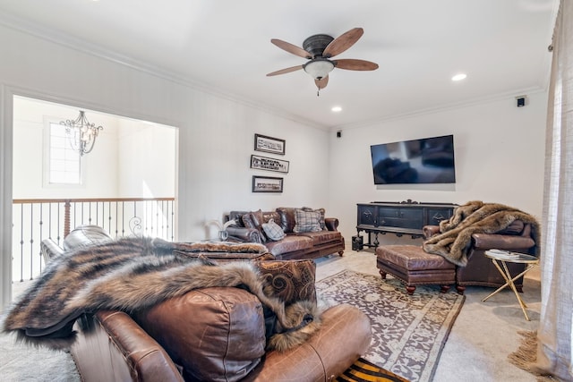 carpeted living room featuring crown molding and ceiling fan with notable chandelier