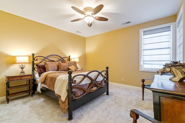 bedroom with light colored carpet and ceiling fan