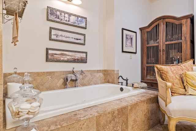 bathroom featuring tiled tub