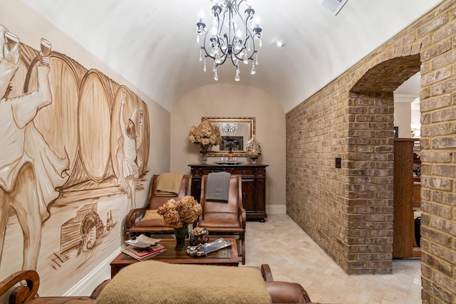 living area featuring brick ceiling, lofted ceiling, and a notable chandelier