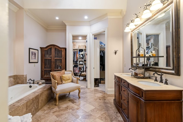 bathroom with crown molding, vanity, and tiled bath