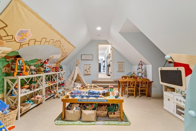 recreation room featuring light colored carpet and lofted ceiling