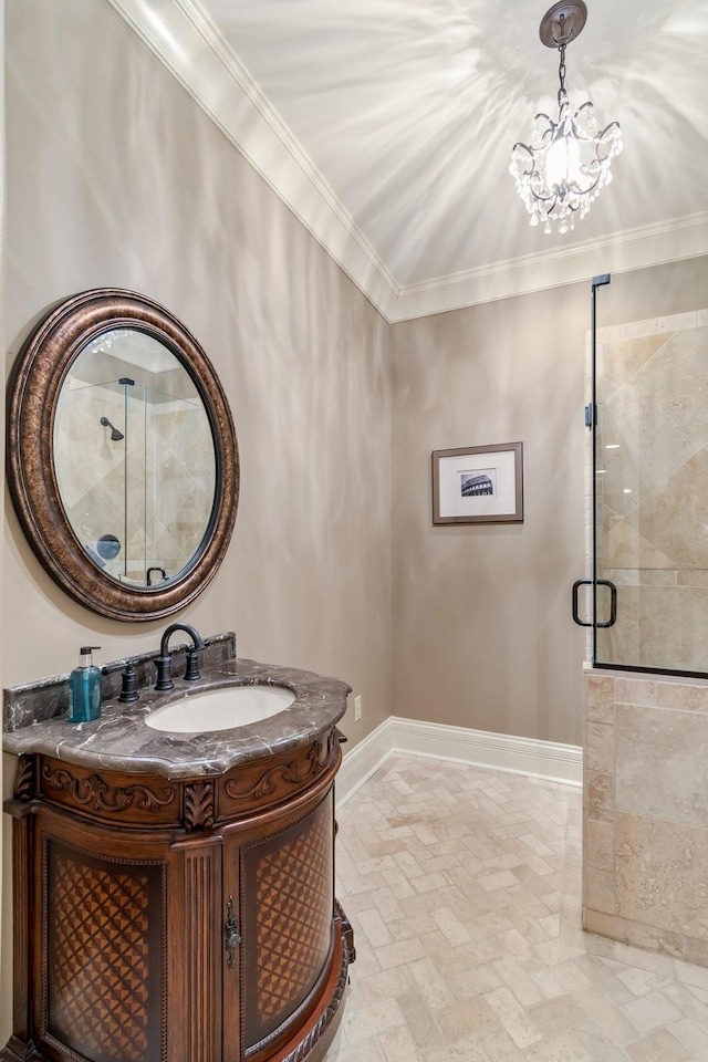 bathroom featuring vanity, a shower with shower door, and ornamental molding