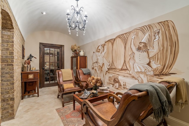 sitting room with brick ceiling, lofted ceiling, and an inviting chandelier